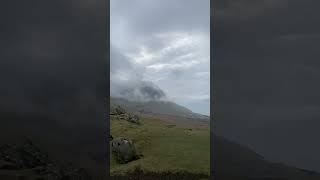 Nice little rolling hill nestled between mountain cliffs #faroeislands #fog #pretty #scenic #hike