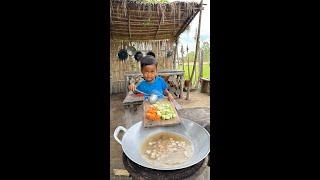 Little chef Bath is on Kitchen make Delicious Soup , Rural life village