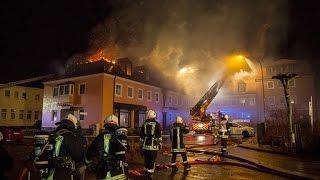 Bautzen - curious onlookers cheer for fire in refugee shelter