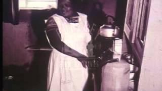 Poor black servant in white South Africa.  Archive film 92633