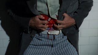 Detective gets his navel sliced open