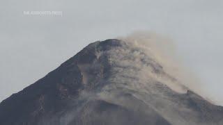 Truckloads of villagers flee as Mayon volcano erupts