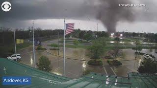 Tornado uproots trees as it rips through city in Kansas