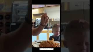 Nurse Hannah Brady Hiatt & Husband Braxton Hiatt Stuffing Their Faces in Front of Their Toddler