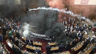 Serbia's parliament session erupts into chaos as opposition MPs set off flares and smoke grenades