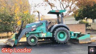 Skip Loader at Work - Asphalt Concrete Pavement Reconstruction (Tractor Loader or Front Loader)