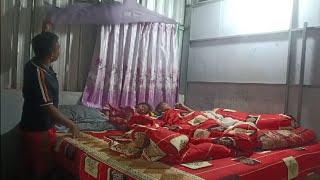 Good husband arranges bed with family and sleeps