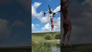 Drone flying pick up a person