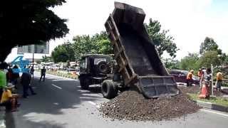 Dump Truck Fuso Unloading Sand in Middle of Road