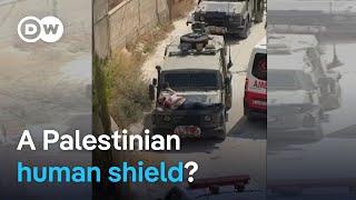 Israeli troops strap man to hood of jeep during West Bank raid | DW News