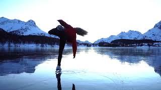 Girl Performs Amazing Ice Skating Act Amidst Mountains In Switzerland - 1181647