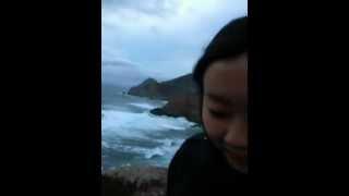 Catherine Poon on Highway 1 next to the Pacific Ocean in California