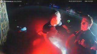 Michigan officers swim out to submerged car to rescue stranded passenger