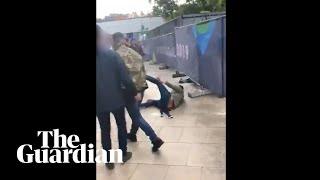 Tommy Robinson filmed punching man outside England match in Portugal