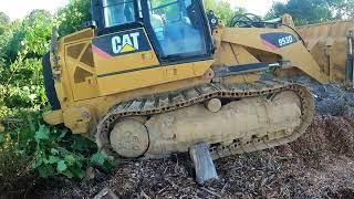 Cleaning up the Woodyard with a Cat 953D and Dropping a Tree