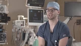 Surgical Technician T.J. Bohannon is encouraged by Orthopedic Surgeon John Macy, MD to grow.