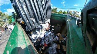 Waste Management garbage truck hopper P.O.V