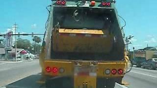 WASTE MANAGEMENT REAR LOADER BEING FOLLOWED