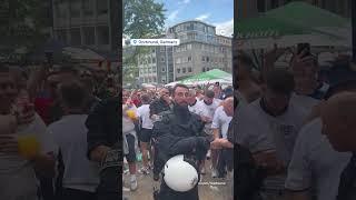 English fans sing to German police officer who looks like Southgate