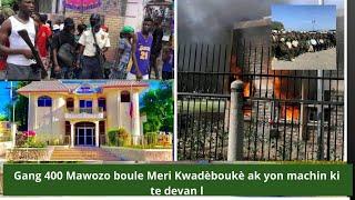 Gang 400 Mawozo boule Meri Kwadèboukè ak yon machin ki te devan li