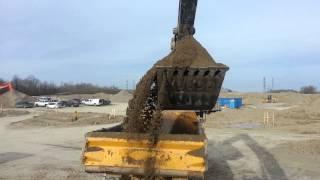 Loading rock trucks with a 470G excavator