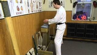 Grandmaster Justin Powells Demonstrates Iron Palm Table With Chain Filled Bag