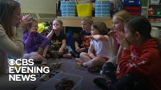 Students learning sign language to support a classmate