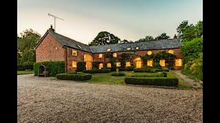 A magnificent 4,230 square feet Cheshire brick barn conversion, set in over 3 acres