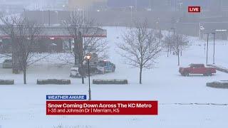 Snow falls throughout the Kansas City area Sunday morning