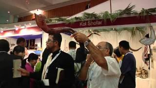 Man blowing the shofar with Jodi-YouTube