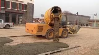 Self Loading Concrete Mixer Machine Discharging Concrete