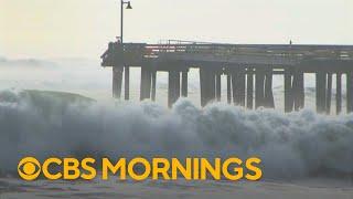 Huge waves tear through Santa Cruz wharf, sending debris into the ocean