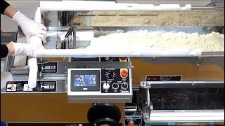 How it's made: dough sheet from scratch on Richmen Gold noodle machine: automatic conveyor in action