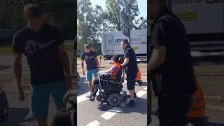 Furious motorists push climate protester in wheelchair off road