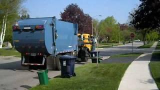 Recycling Truck Picking Up Recyclables