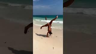 What is that bent leg about  #mexico #beachflips #bikini #gymnastics #backflip