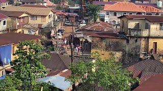 Alleged escaped prisoners walk in streets of Sierra Leone's Freetown | AFP