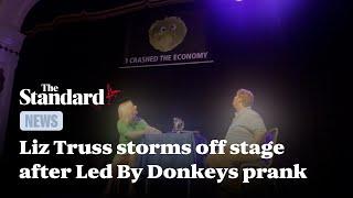 Liz Truss storms off stage after noticing Led By Donkeys’ banner