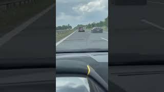 An F1 car just casually on the highway 