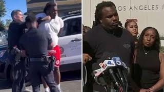 Investigation launched after video shows LAPD officer punch handcuffed man in Watts