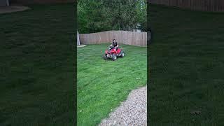 a wheelie on a manual four wheeler