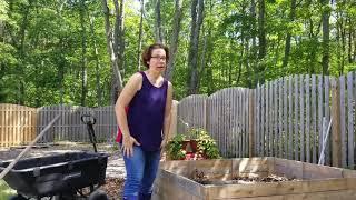 Fill raised garden beds with logs and compost to build great soil