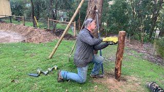 Setting the fence posts for the last section of the garden fence - Urban Vegetable Garden