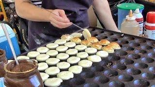 London Street Food. Cooking Sweet Dutch Pancakes "poffertjes" in Camden Lock Market