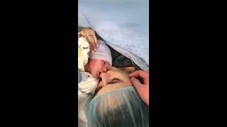 Newborn meets mom for first time