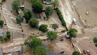 Trapped driver rescued as flash flooding hits California