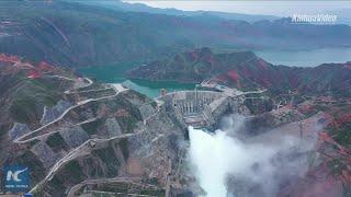 Large hydropower station in Qinghai, China opens sluice gates to fight flood