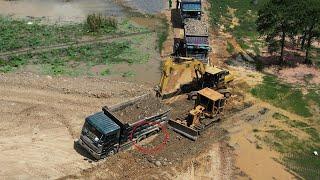 Mini bulldozer and excavator use power recovery ten wheeler dump truck stuck mud