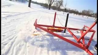 Grooming cross-country ski trails.