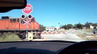 Spoornet Class 34 at railway crossing